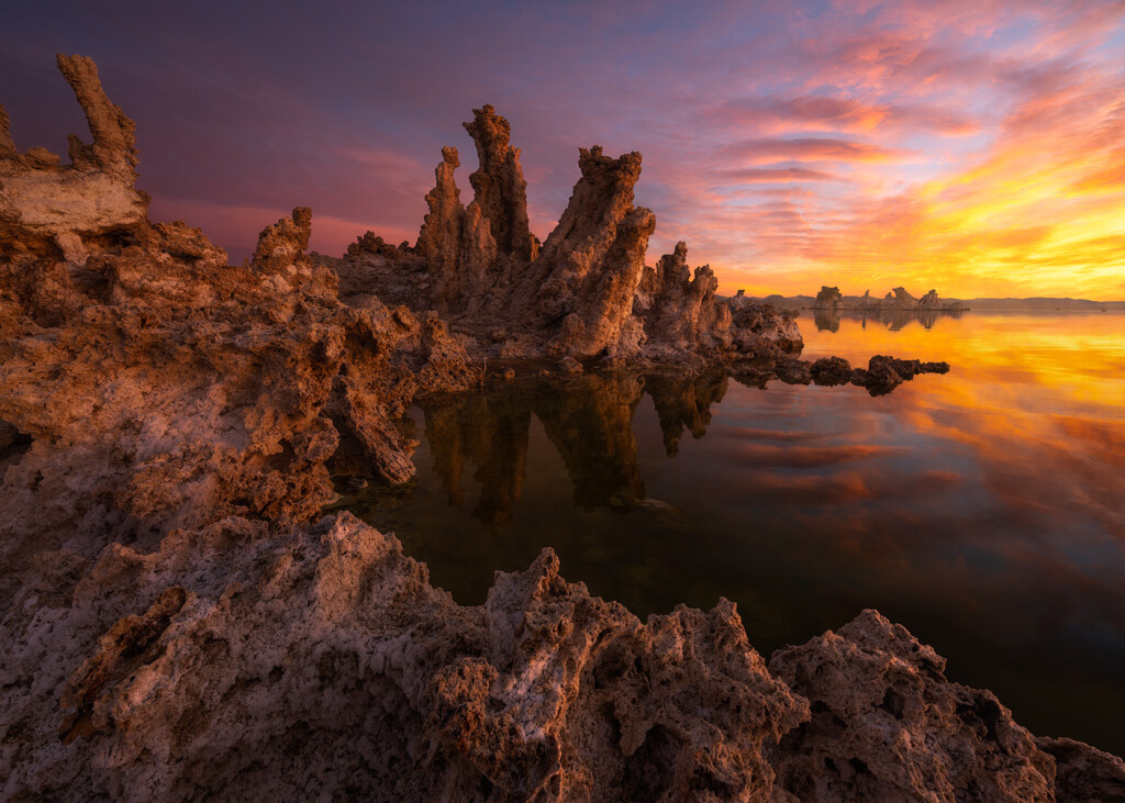 A burning sunrise with tufas rising out of Mono lake in California