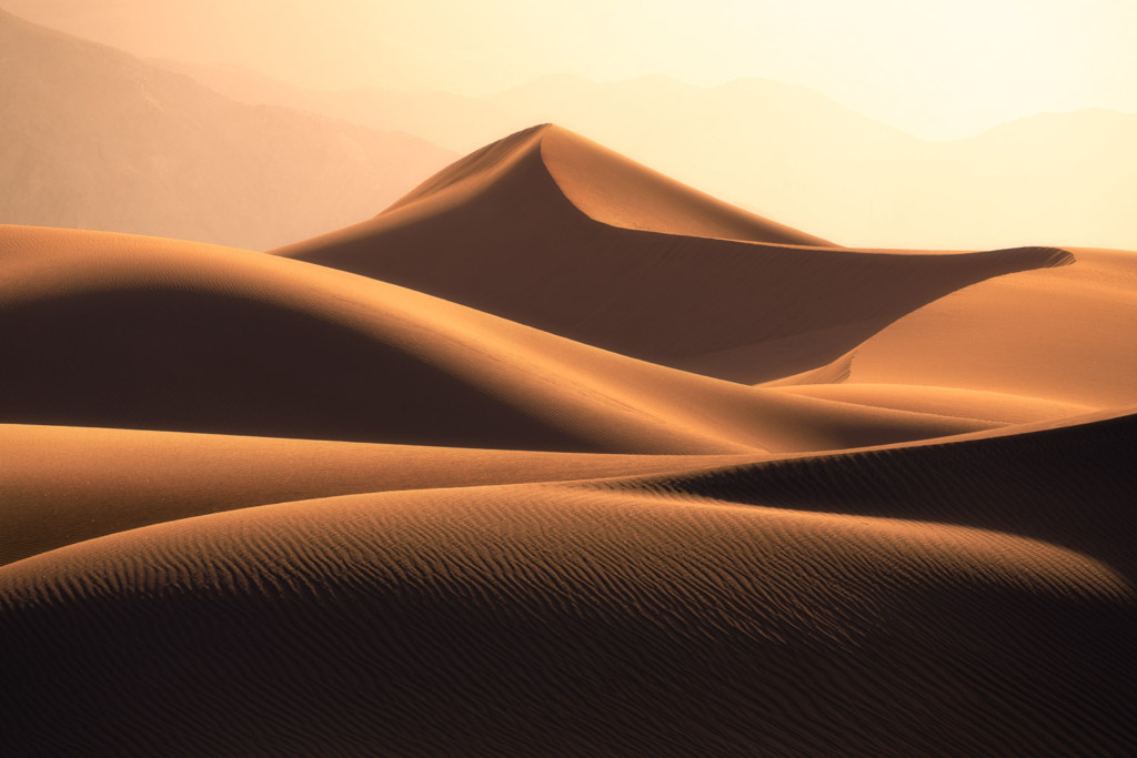 The setting sun contours the dunes of Death Valley and highlights the unique textures which can only be found in the desert.