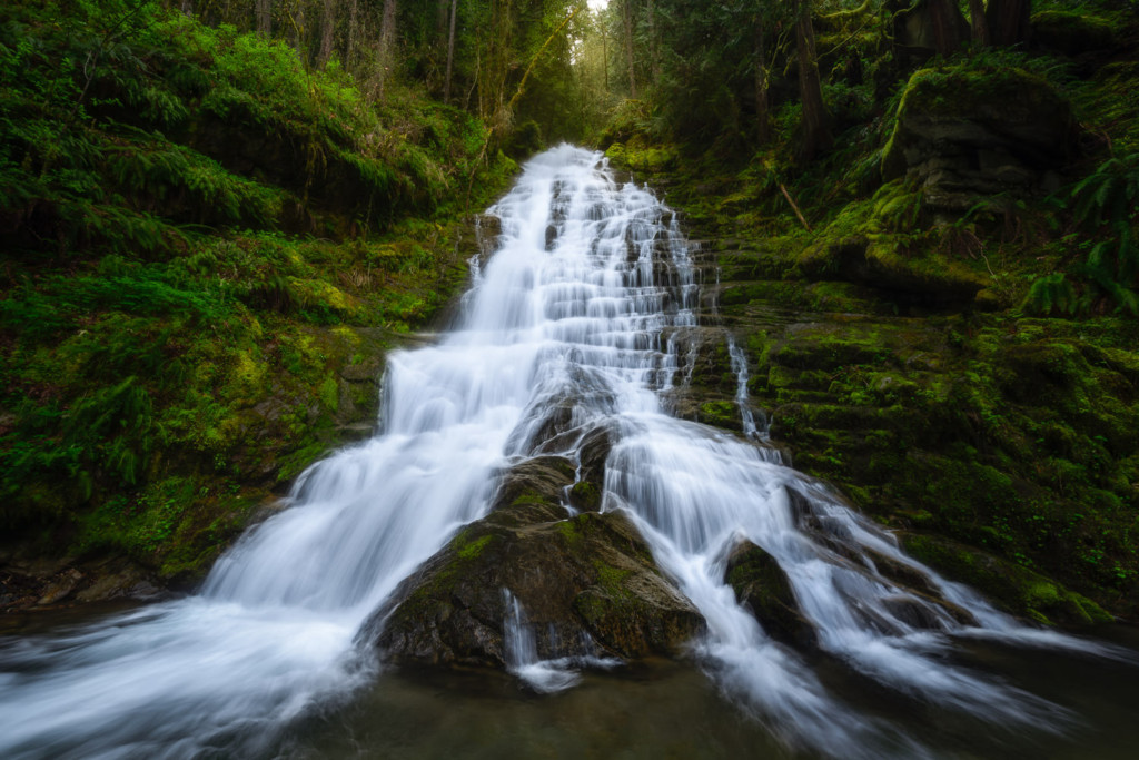 Flowing waterfall near Mt Rainier on a spring day in Washington